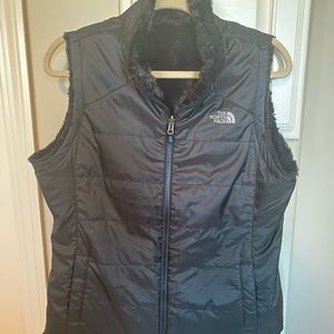 North face reversible black swirl vest.